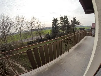 a balcony with a wooden fence and a walkway at Apartments Andrej - Poetovio & Ptuj in Ptuj