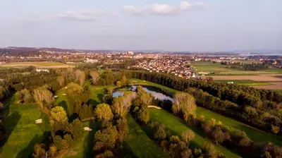 an aerial view of a golf course with a river at Apartments Andrej - Poetovio & Ptuj in Ptuj
