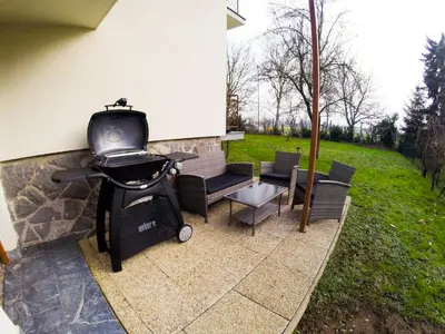 a grill on the side of a house at Apartments Andrej - Poetovio & Ptuj in Ptuj