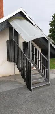 a stairway leading up to a building at 4 seasons apartment Radovljica in Radovljica