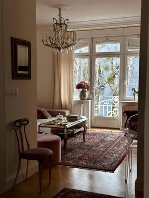 a living room with a couch and a table and a window at Adora Luxury Hotel in Bled