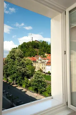 a window with a view of a city at Galeria River in Ljubljana