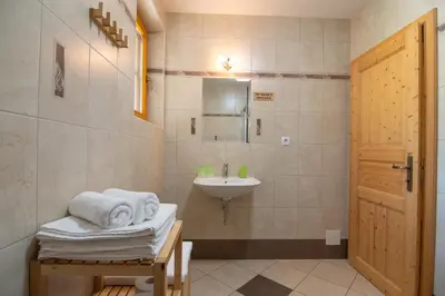 a bathroom with a sink and a toilet and a mirror at Tourist Farm 