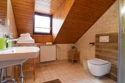 a bathroom with a toilet and a sink at Tourist Farm 