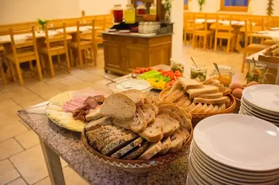 a table with a bunch of different types of bread at Tourist Farm 
