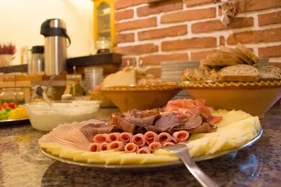 a plate of food on a counter in a kitchen at Tourist Farm 