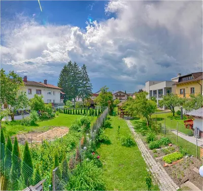 a view of a garden in a residential neighbourhood at Studio Southwest 2 semi-basement in Ljubljana