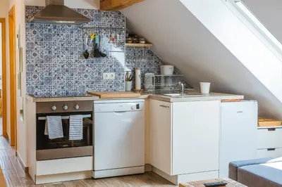a kitchen with a sink and a stove at Pr'Jernejc Agroturism in Lesce