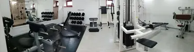 a gym with treadmills and exercise equipment in it at Sobe Levc in Mozirje