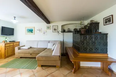 a living room with a couch and a table at Holiday House in Nature with Pool, Pr Matažič in Kamnik