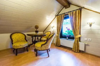 a room with a table and chairs and a window at Holiday House in Nature with Pool, Pr Matažič in Kamnik
