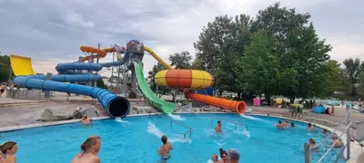 a group of people in a pool at a water park at Boho House 5 camp Terme Catez with promotional tickets prices in Čatež ob Savi