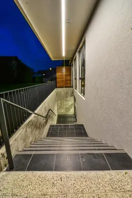 a stairway leading up to a building at night at Accommodation Vitalis in Ljubljana