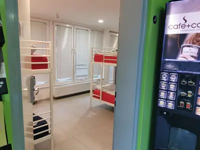 a vending machine in a room next to a store at Simbol Rooms with free private parking in Ljubljana