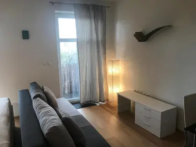 a living room with a couch and a table at Apartment Na skali in Kranj