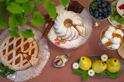 a table topped with plates of food and desserts at Boutique Hotel Dobra Vila Bovec in Bovec