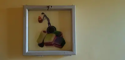 a mirror on a wall with a picture of a person at Villa Coola in Ljubljana