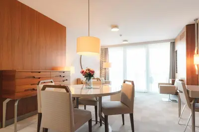 a dining room with a table and chairs at Hotel Terme - Terme Čatež in Čatež ob Savi