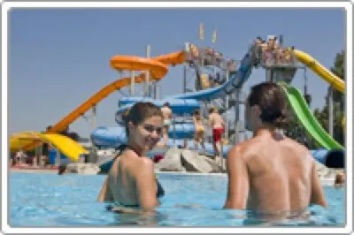 two people in the water at a water park at Marinčič Inn in Škocjan