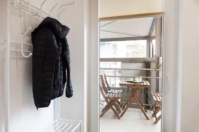 a coat hanging on a wall next to a door at Felix apartment Tour As Ljubljana in Ljubljana