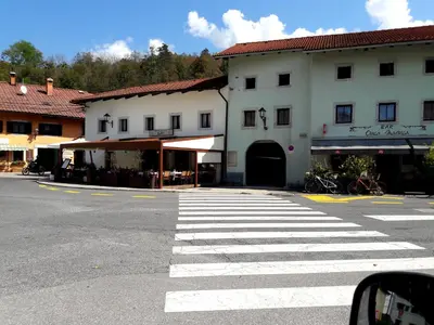 a crosswalk on a street in front of a building at Cosy cottage with views near Kobarid in Kobarid
