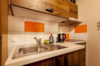 a kitchen with a sink and a counter top at Beer & wine cellar in Ljubljana