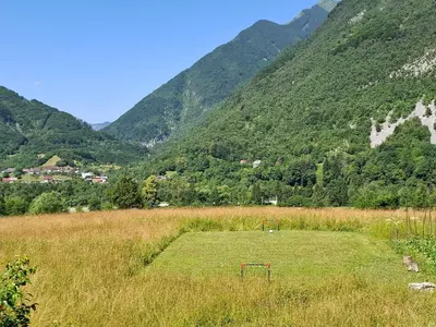 a field with a soccer ball in the middle of a mountain at APARTMA ANA IDA in Srpenica