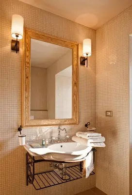 a bathroom with a sink and a mirror at B&B Dvor Tacen in Ljubljana