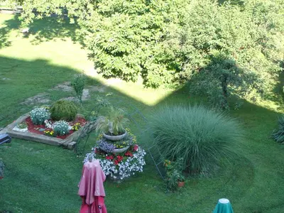 an overhead view of a garden with flowers and a fountain at Guest House Čater in Laško