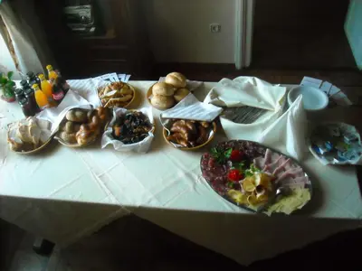 a table with many different types of food on it at Guest House Čater in Laško