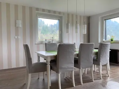 a dining room with a table and chairs at Entire house Iris & Arnika in Bled