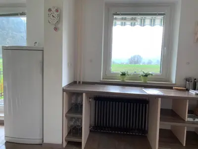 a wooden desk in a room with a window at Entire house Iris & Arnika in Bled
