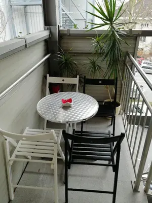 a small table and two chairs on a balcony at Flex Apartments Tour As Ljubljana in Ljubljana