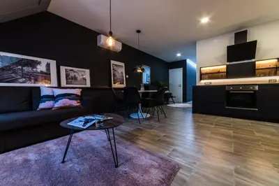 a living room with a couch and a table at Flex Apartments Tour As Ljubljana in Ljubljana