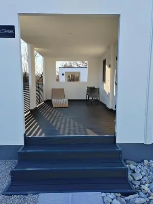 a view from the inside of a house with blue stairs at Prenočišča Kogoj in Miren