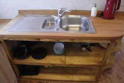a kitchen sink in a wooden counter top at Harmony Gallery in Ljubljana