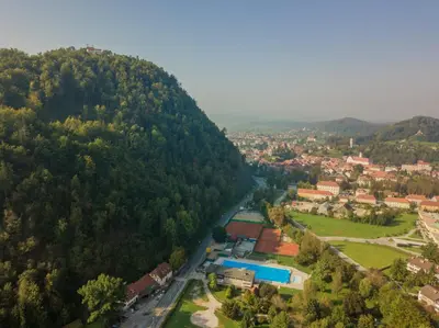 an aerial view of a town in a mountain at B&B Pod Skalo in Kamnik