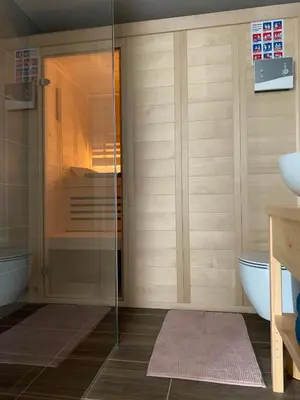 a bathroom with a glass shower and a toilet at Holiday house Nune in Zreče