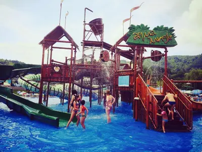 a group of people in the water at a water park at Apartment Amy in Podčetrtek