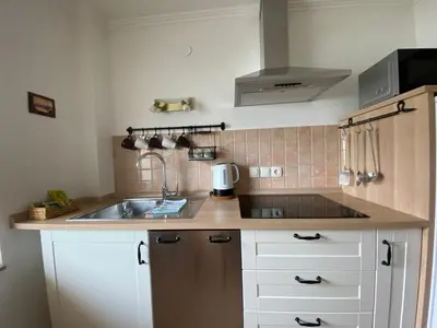 a kitchen with a sink and a counter top at Apartments Vila Cvetka Bled in Bled