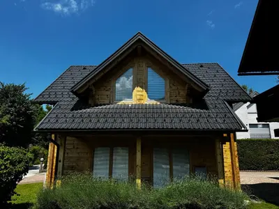 a house with a window on top of it at Apartments Vila Cvetka Bled in Bled