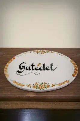 a plate with the word buffet on top of a table at Merkež Guest House in Bizeljsko