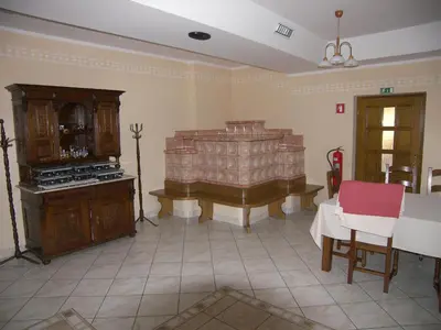 a living room with a table and a piano at Grobelnik Tourist Farm in Sevnica