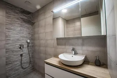 a bathroom with a sink and a shower at Vila Mojca Apartma Eva-Neža, Kranjska Gora (center) in Kranjska Gora