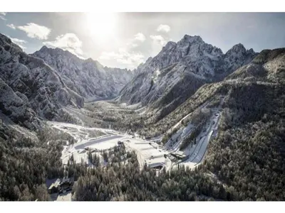 an aerial view of a mountain valley with a road at Vila Mojca Apartma Eva-Neža, Kranjska Gora (center) in Kranjska Gora