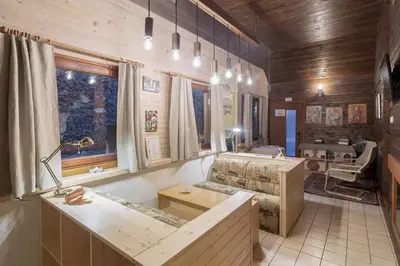 a living room with a couch and a table at Apartment house Jager in Bohinj