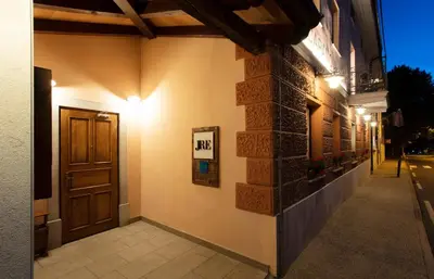 a hallway of a building with a door and lights at Špacapanova hiša in Komen