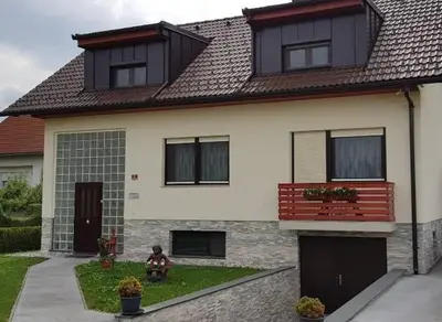 a house with a brown and white at Apartma Sebastjan Dobova near Terme Paradiso in Dobova