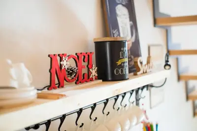 a shelf with a coffee cup on top of it at Apartments Maison in Kranjska Gora