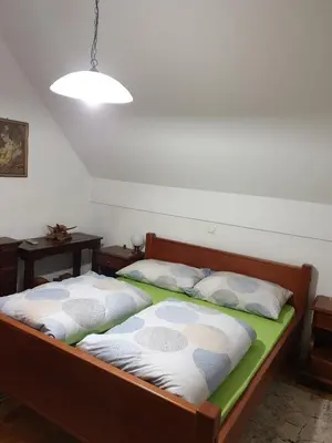 two twin beds in a room with two tables at Terme Čatež Apartma Nine in Čatež ob Savi